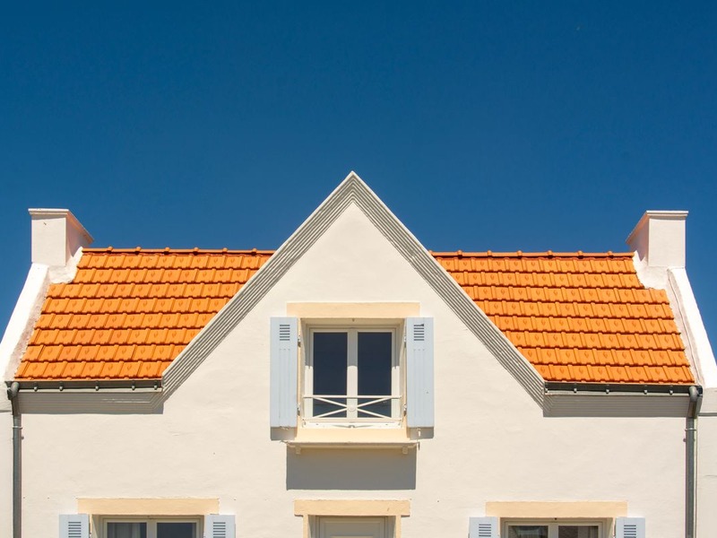 After tile restoration showing brand new, sparkling clean Mediterranean tile roof on a Scottsdale luxury residence