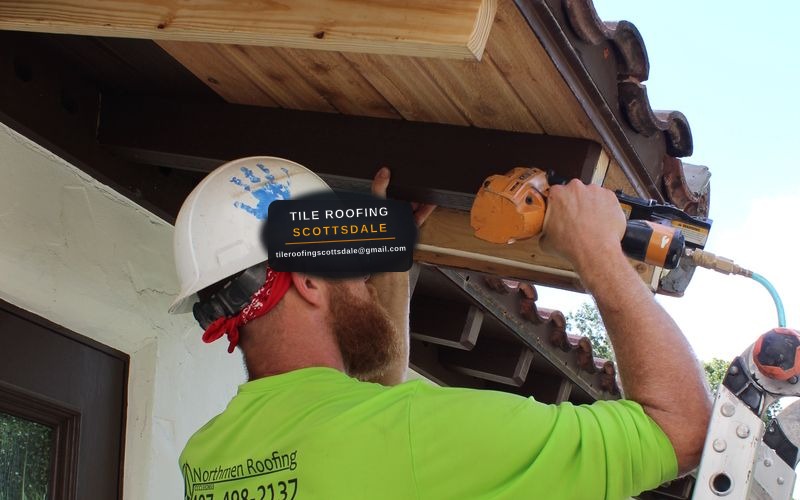 Tile Roofing Scottsdale licensed professional roofer repairing Spanish terracotta clay roof tiles with mortar and replacement tiles in Scottsdale AZ